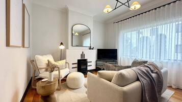 TV, fireplace, books, stereo