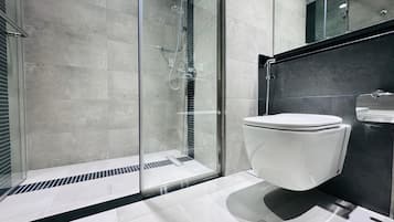 Shower, hair dryer, slippers, towels