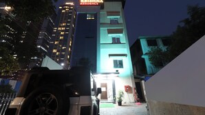 A hotel named 'Hotel Krishna Residency' with a modern design, featuring a prominent sign and a well-lit entrance. - Hotel Krishna Residency  (Navi Mumbai)