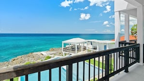 A seaside property with a pool, a gazebo, and a view of the ocean. - The W Villa 5 B R Oceanfront w Staff (Whitehouse)