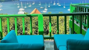 A balcony with a view of the sea and sailboats. - Turtle Point Bequia - 4 B R Villa w Staff (Bequia Island)
