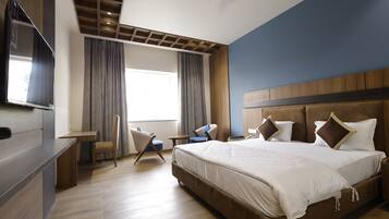 Premium bedding, desk, laptop workspace, blackout curtains