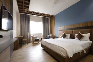 Premium bedding, desk, laptop workspace, blackout drapes - Nirvana Grand Hotel & Resort (Gaya)