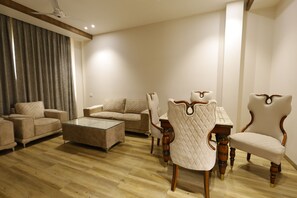 Luxury Suite, Pool View | Living area | 42-inch LED TV with cable channels - Nirvana Grand Hotel & Resort (Gaya)