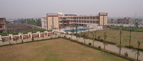 A large building with multiple floors and a central courtyard.