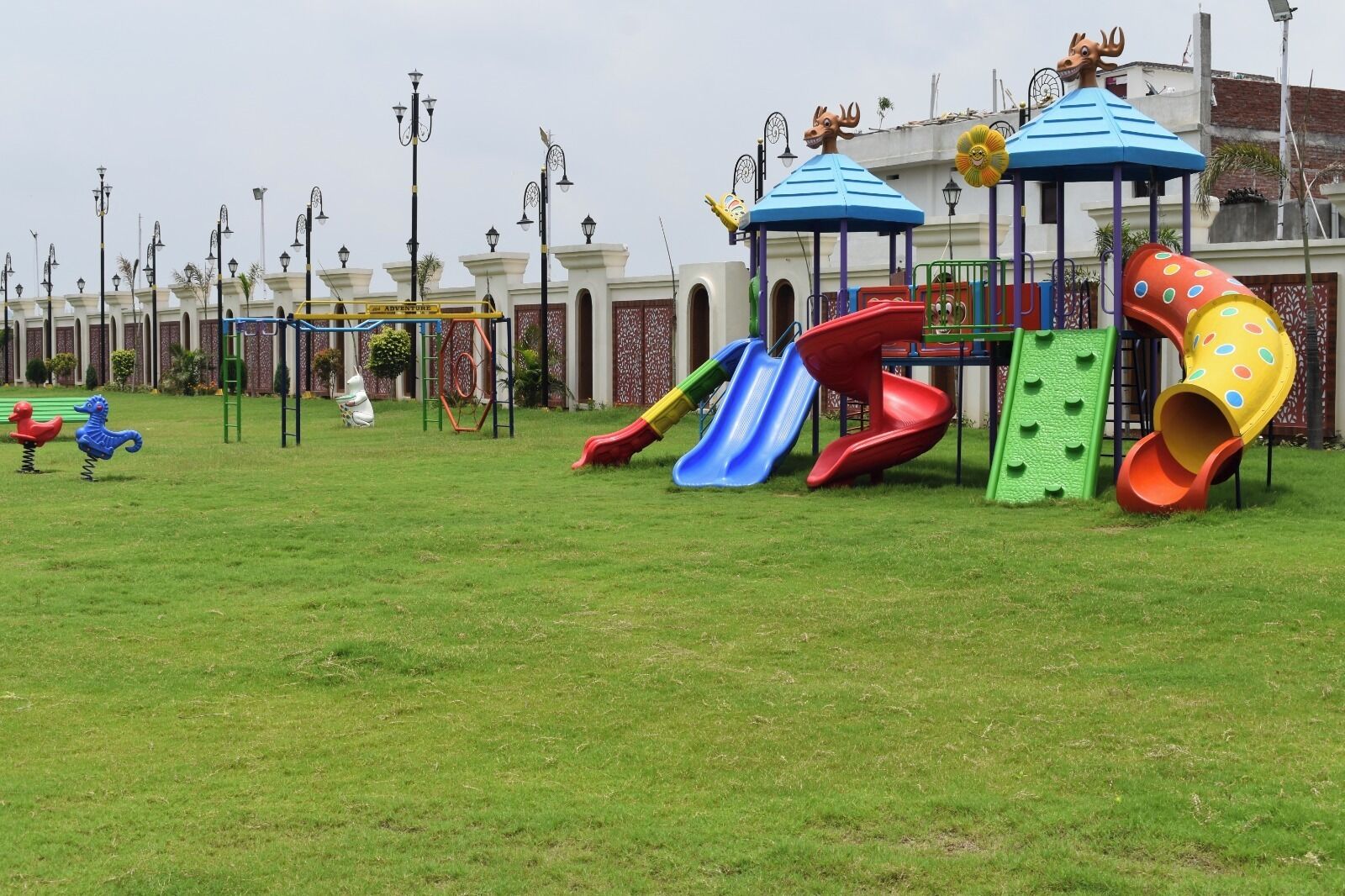 A playground with slides and a climbing structure.