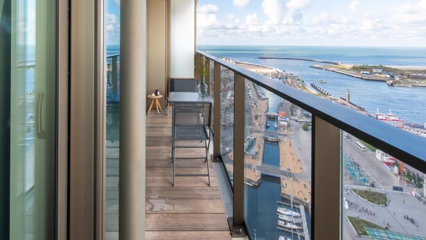 A balcony with a view of a marina and the sea. - Central Apartment in Ostend Near Beach (Ostend)