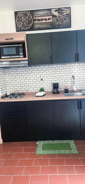 Fridge, microwave, stovetop, coffee/tea maker