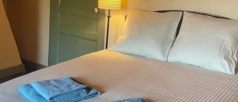 1 bedroom, desk, iron/ironing board, travel crib