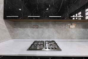 Deluxe Suite, Multiple Beds, City View | Private kitchen - Capital 11 Hotel (North Legon)