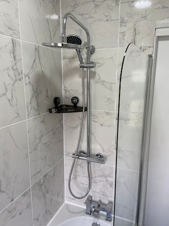 Shower, jetted bath, towels, soap. Peeams Abode