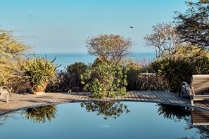 2 outdoor pools, pool umbrellas, pool loungers