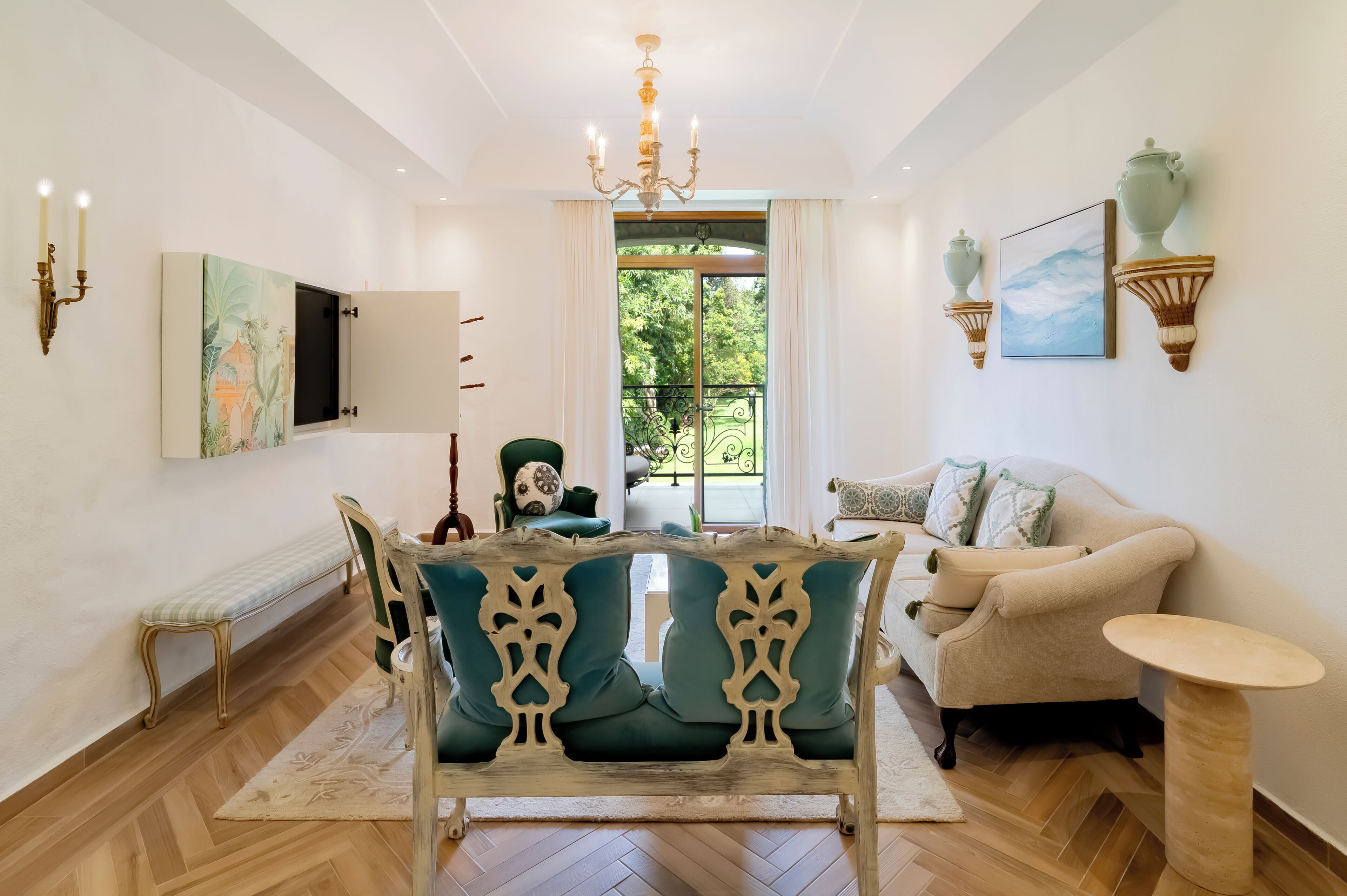 A well-lit room with a wooden bench, a sofa, and a table.