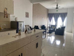 Apartment | Living room | 32-inch flat-screen TV with cable channels - Hotel O Bayu Service Apartment (Langkawi)