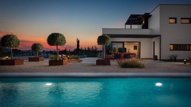 A modern house with a swimming pool, surrounded by landscaped gardens and trees. - Villa Promissa Terra - luxury and breathtaking villa (Dubrava kod Šibenika)