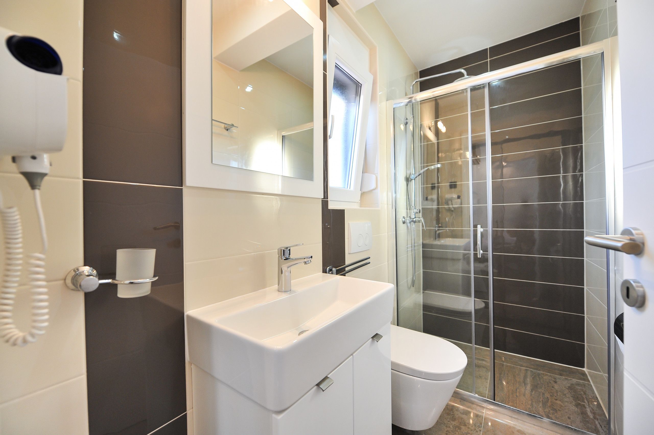 Shower, hair dryer, towels