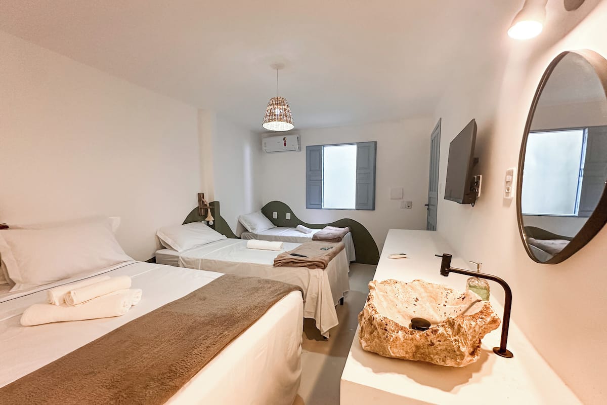 Basic Quadruple Room, Garden View | Minibar, individually decorated, blackout drapes, free WiFi