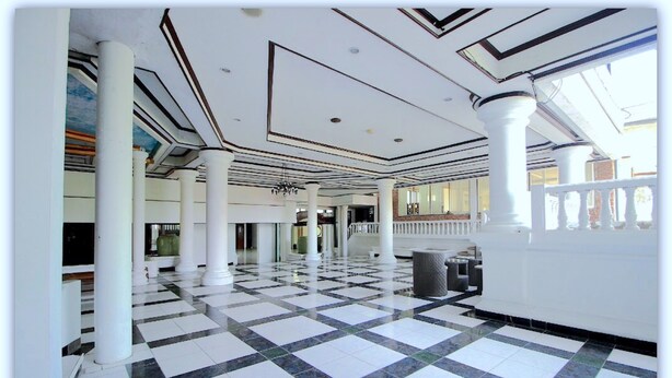 A spacious lobby with a checkered floor, white columns, and a large window allowing natural light. - Makati Rio Hotel (Bengkulu)