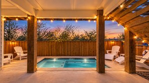 A backyard with a swimming pool, wooden deck, and Adirondack chairs. - Palm Beach! Private Pool - Boardwalk - Game Room! (Port Aransas)