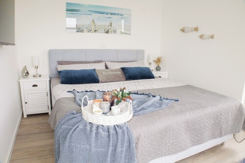 Meerzeit Tossens – Urlaub mit Hund. Dachterrasse. Deichblick.