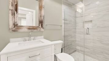 Shower, towels, soap, toilet paper
