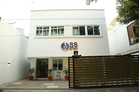 A modern building with a sign reading "SS STAY".