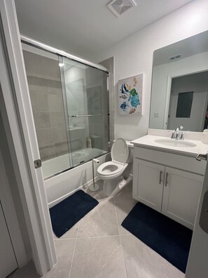 Shower, towels, soap, toilet paper