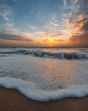 On the beach, sun-loungers