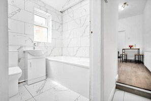 Apartment | Bathroom | Combined shower/tub, deep soaking tub, hair dryer, towels