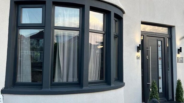 A corner building with a curved window and a door. - Luxury Seymour House With Spa, Gym & Lake District (Morecambe)