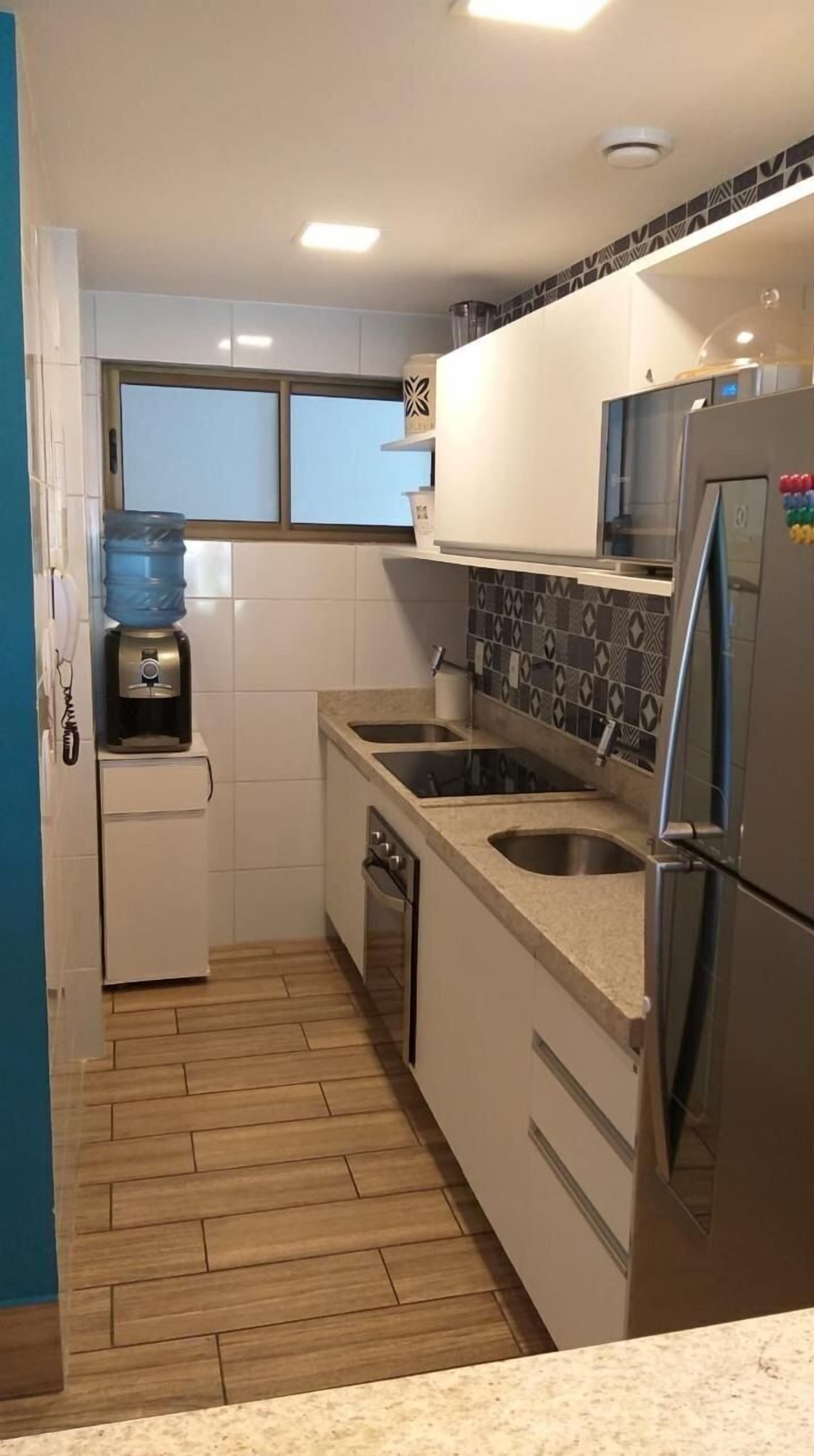 Classic Apartment | Private kitchen | Microwave, toaster oven, cookware/dishes/utensils, cleaning supplies