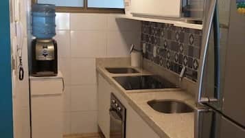 Classic Apartment | Private kitchen | Microwave, toaster oven, cookware/dishes/utensils, cleaning supplies