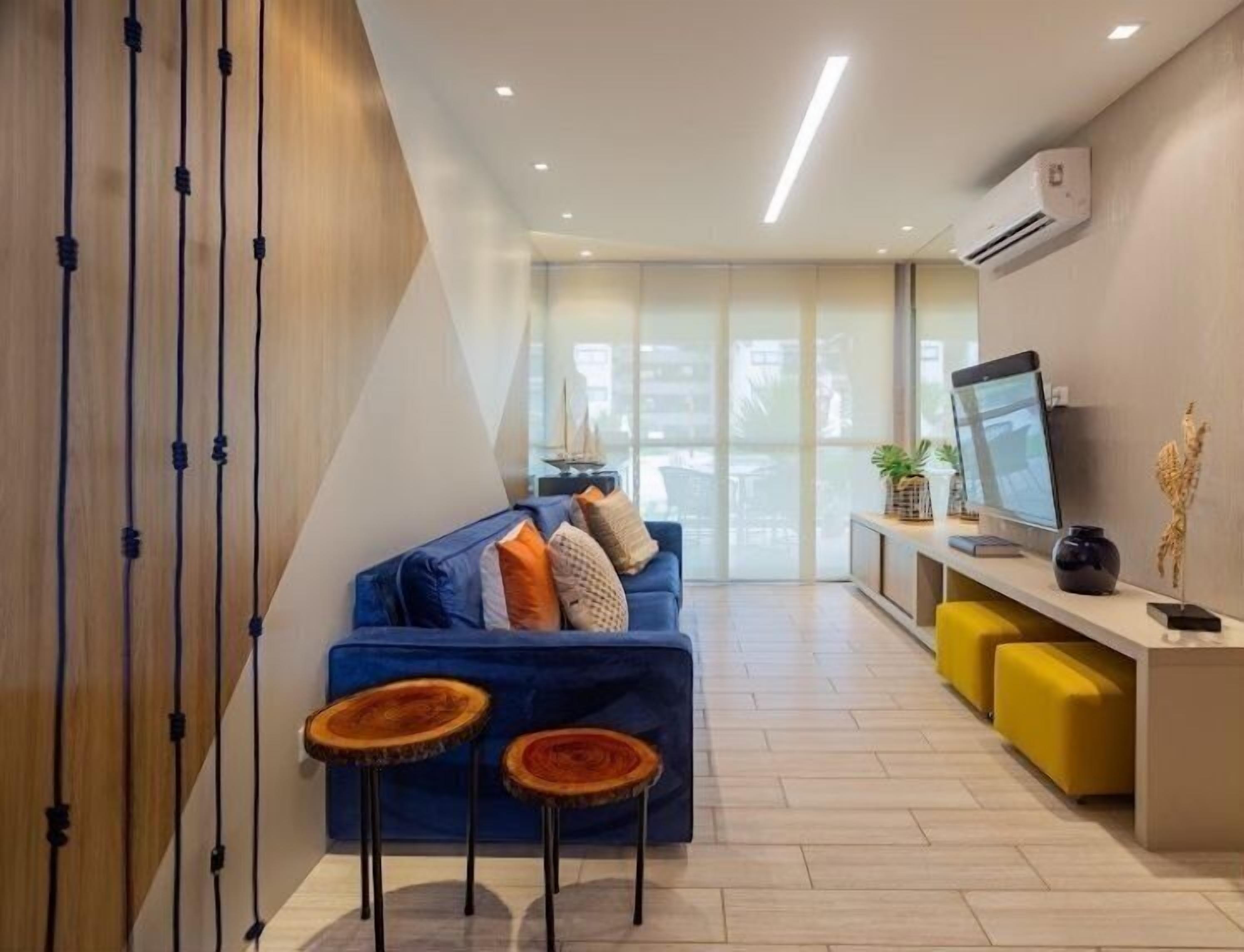 Apartamento premium | Área de estar | TV LED