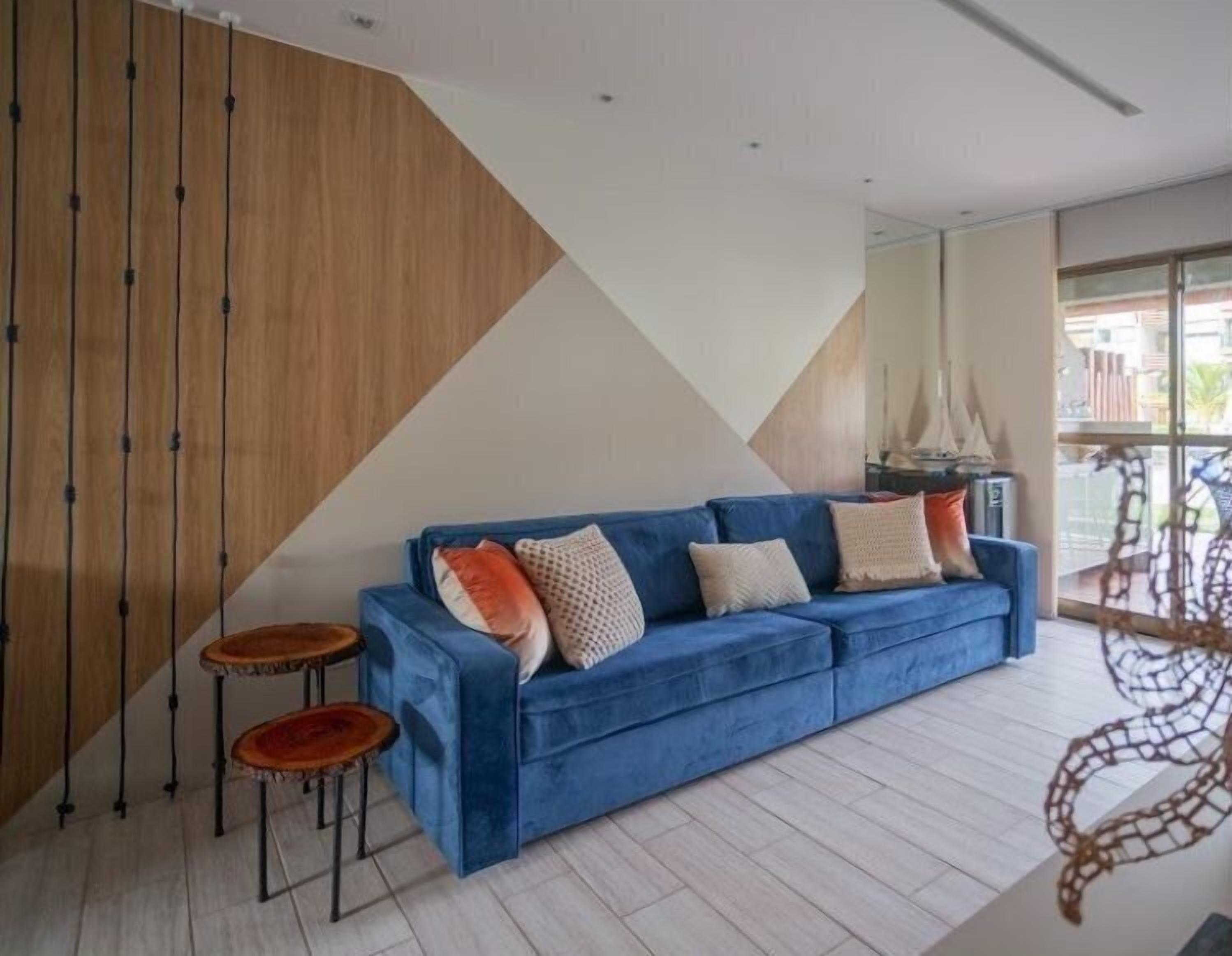 Apartamento premium | Área de estar | TV LED
