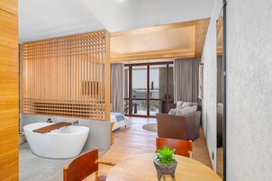 Junior Suite, 1 King Bed, City View | Bathroom | Deep soaking tub, rainfall showerhead, hair dryer, towels