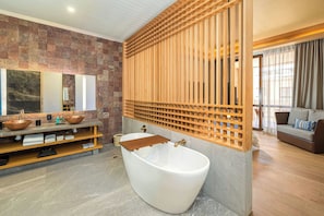 Deep soaking tub, rainfall showerhead, hair dryer, towels