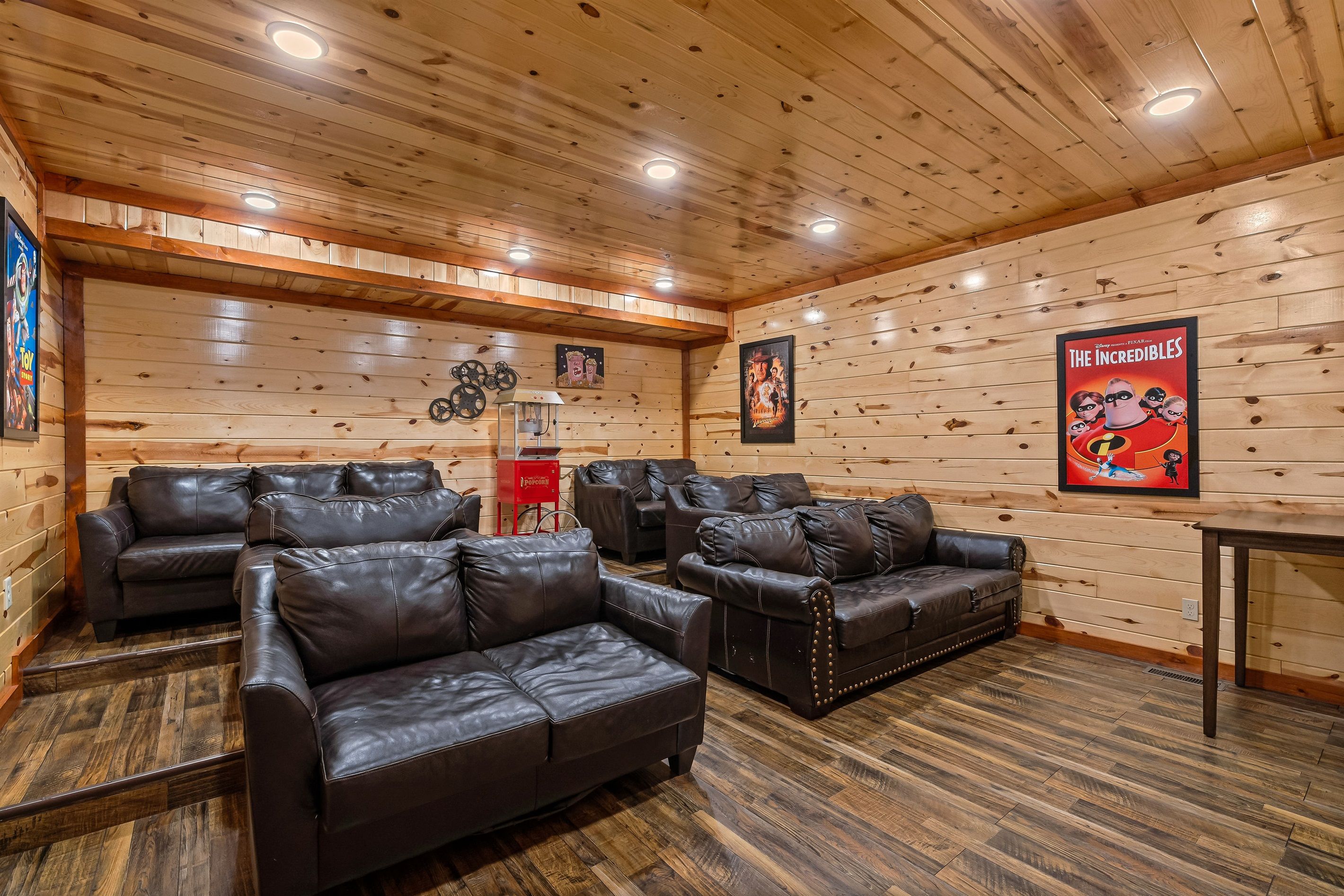 Theater room featuring a popcorn machine and seating for 12