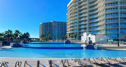 Brilliant water view condo with multiple pools, lazy river & internet