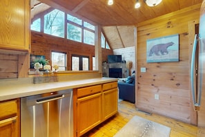 Enjoy cooking in this well-equipped kitchen with a dishwasher and large window.