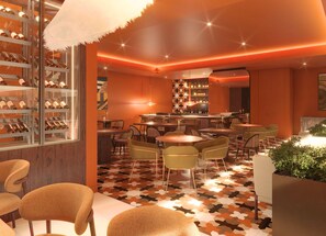 A modern bar area with a wine rack, multiple tables, and chairs. - Kimpton Atlantico Algarve (Albufeira)