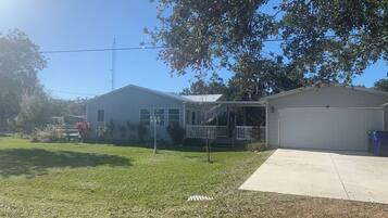 Stroll through the serene surroundings of this single-story home, complete with a cozy front porch and a garage.