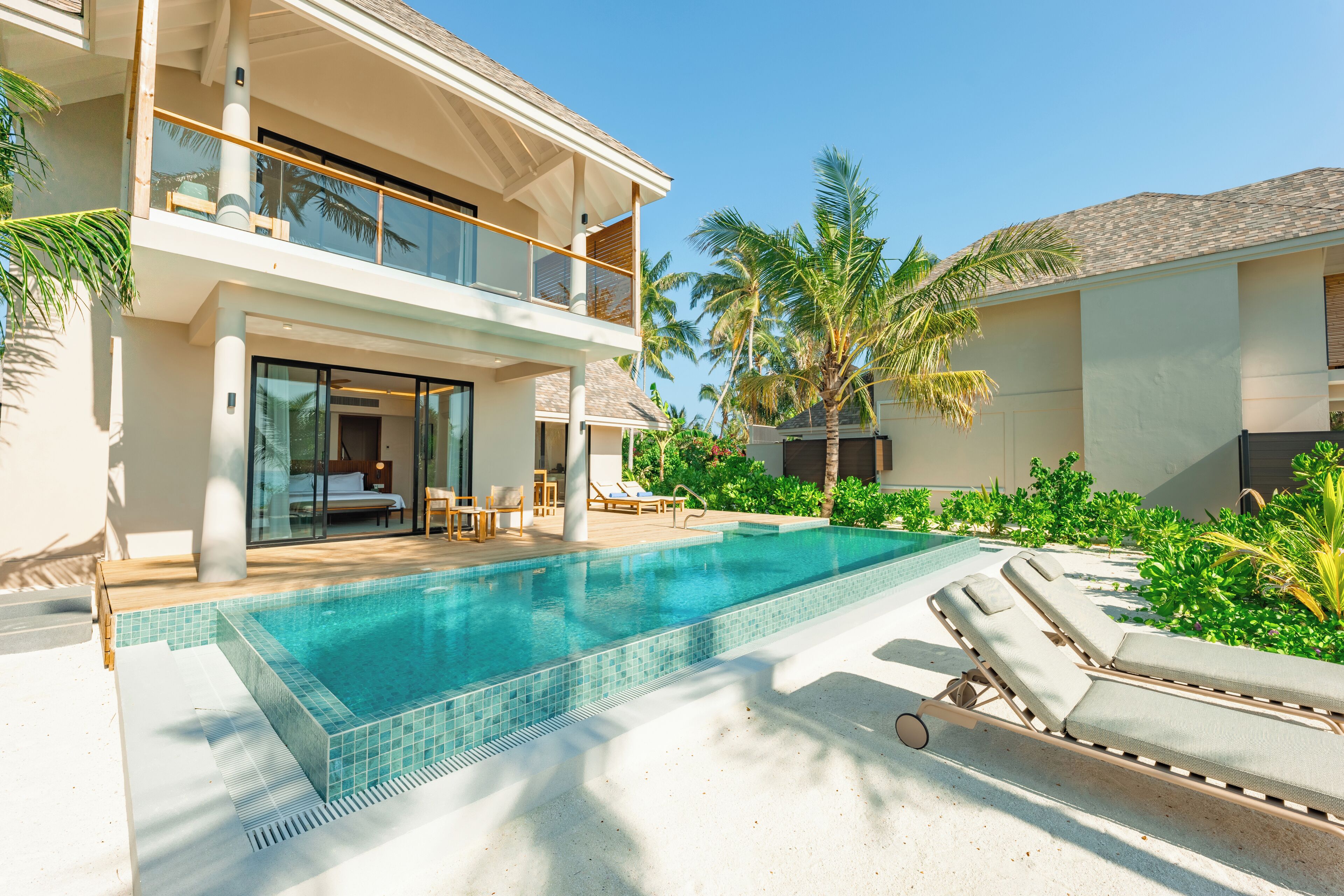 2 outdoor pools, pool umbrellas, pool loungers