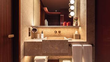 Designer toiletries, hair dryer, bathrobes, slippers