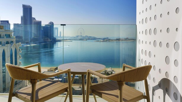 A balcony with a view of a city skyline and a body of water. - Tumbi Hotel Dubai The Palm, Tapestry Collection by Hilton (Dubai)