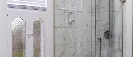 Shower, hair dryer, towels, soap