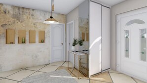 A modern interior with a tiled floor, a hanging pendant light, a white door with glass panels, and a small table with a vase and a book. - Gorgeous home in Lucane (Lucane)
