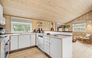 Fridge, stovetop, dishwasher, coffee/tea maker