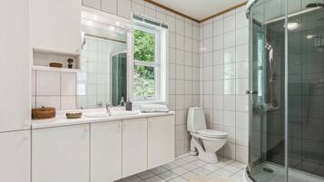 Shower, towels, soap, toilet paper