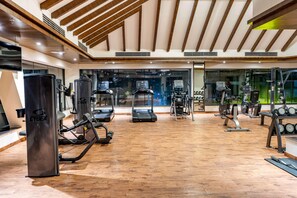 A gym with treadmills, weight machines, and a punching bag. - Ramada by Wyndham Kathmandu Dhumbarahi (Kathmandu)
