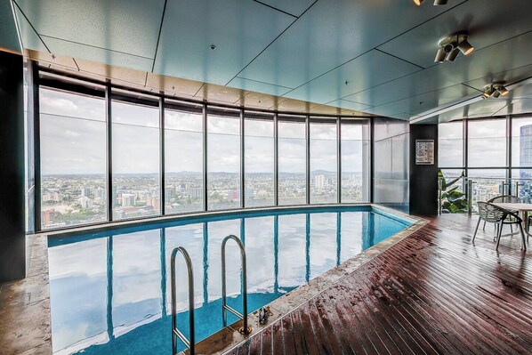 Enjoy a refreshing swim with a stunning city view from the pool area.